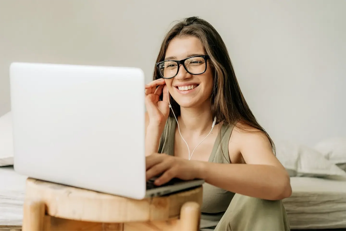 freelancer-woman-at-online-meeting-using-laptop-and-headphones-